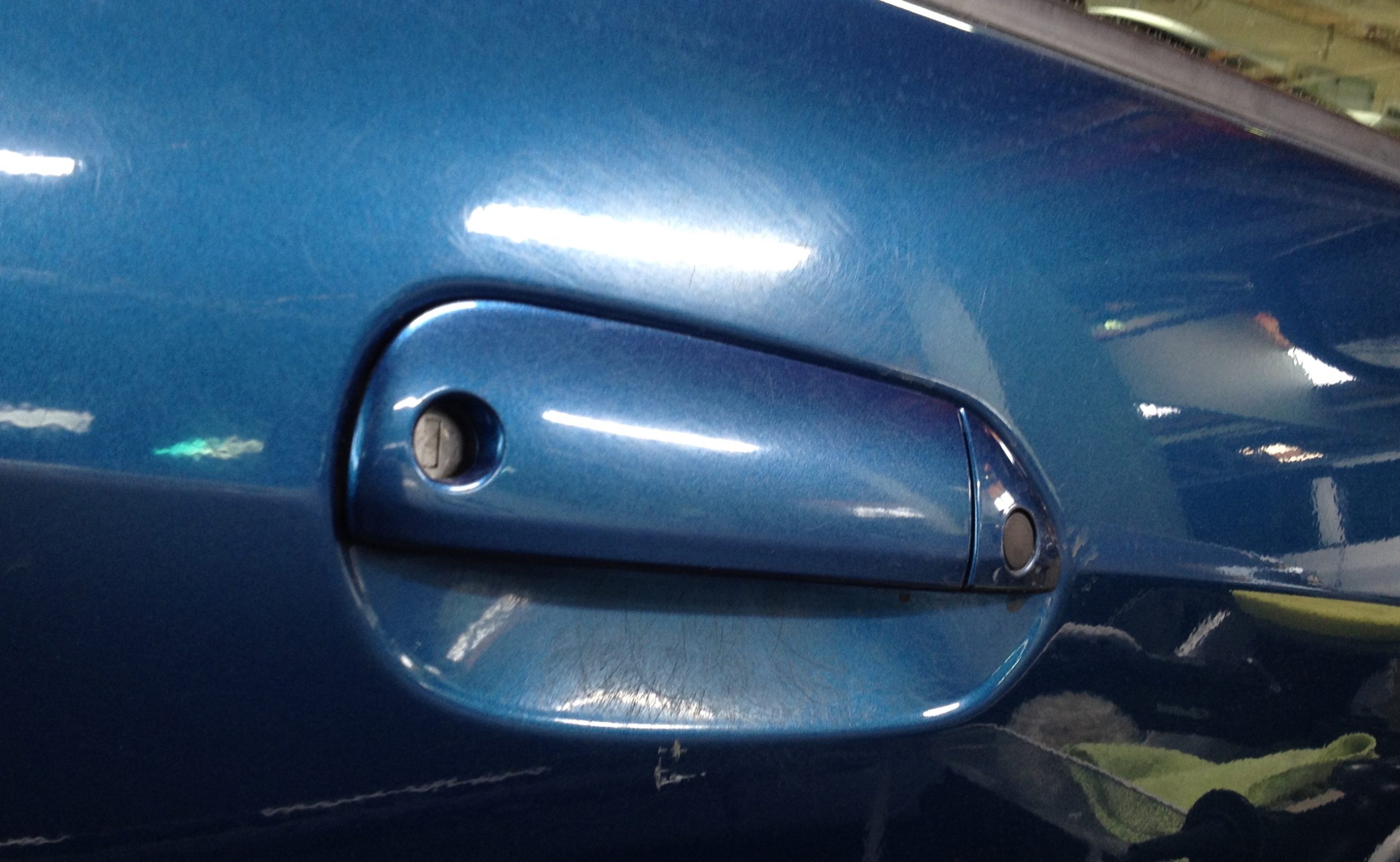 Scratches under door handle Honda Fit